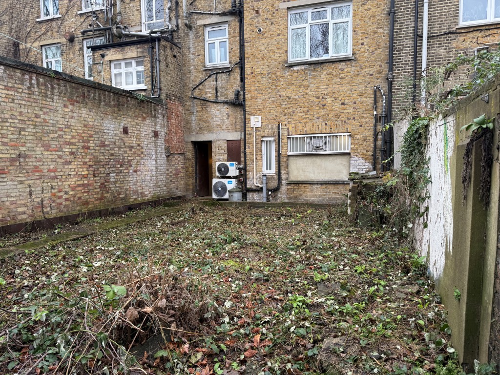 Lot: 44 - LAND WITH POTENTIAL JUST OFF CLAPHAM COMMON - View of land from rear showing brick elevation